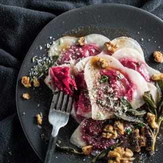 Want to impress your date? Make them Beet and Goat Cheese Ravioli tossed in brown butter and sprinkled with crispy sage and walnuts. It'll be our secret that the ravioli is made with wonton wrappers and is SUPER easy to make. Wonton ravioli is a perfect Valentine's Day dinner recipe or for anytime you're looking for something a little extra special. | theendlessmeal.com