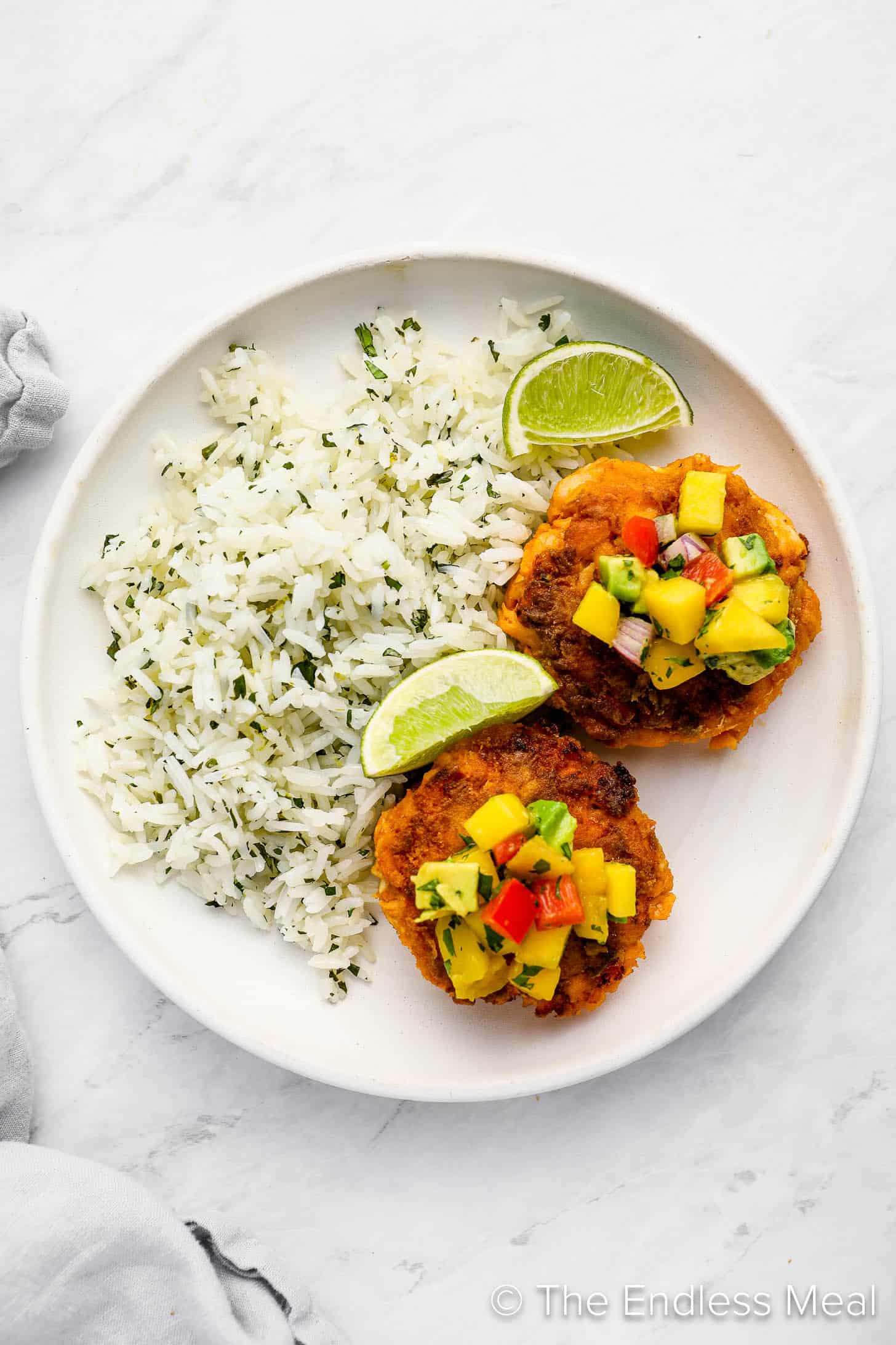 Thai Fish Cakes on a dinner plate with rice