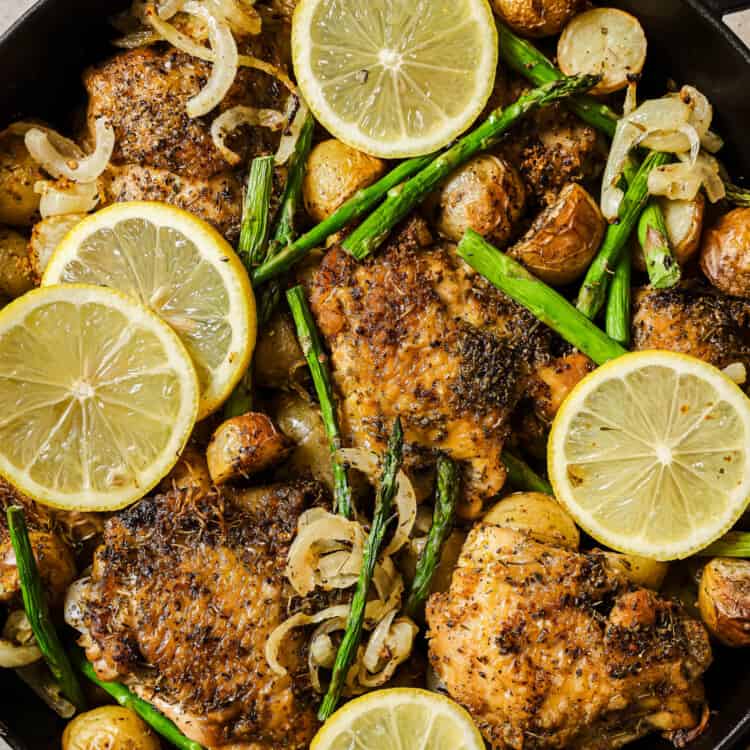 Greek Lemon Chicken and Potatoes cooking in a pan