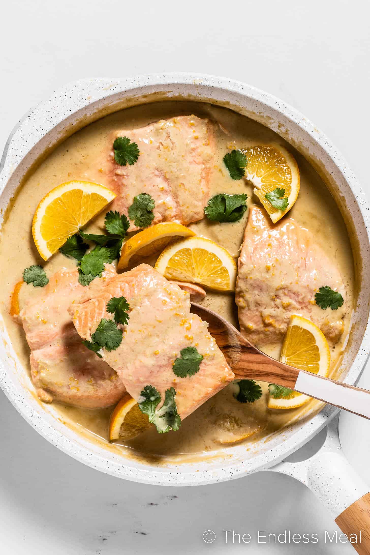 Coconut Orange Poached Salmon in a pan