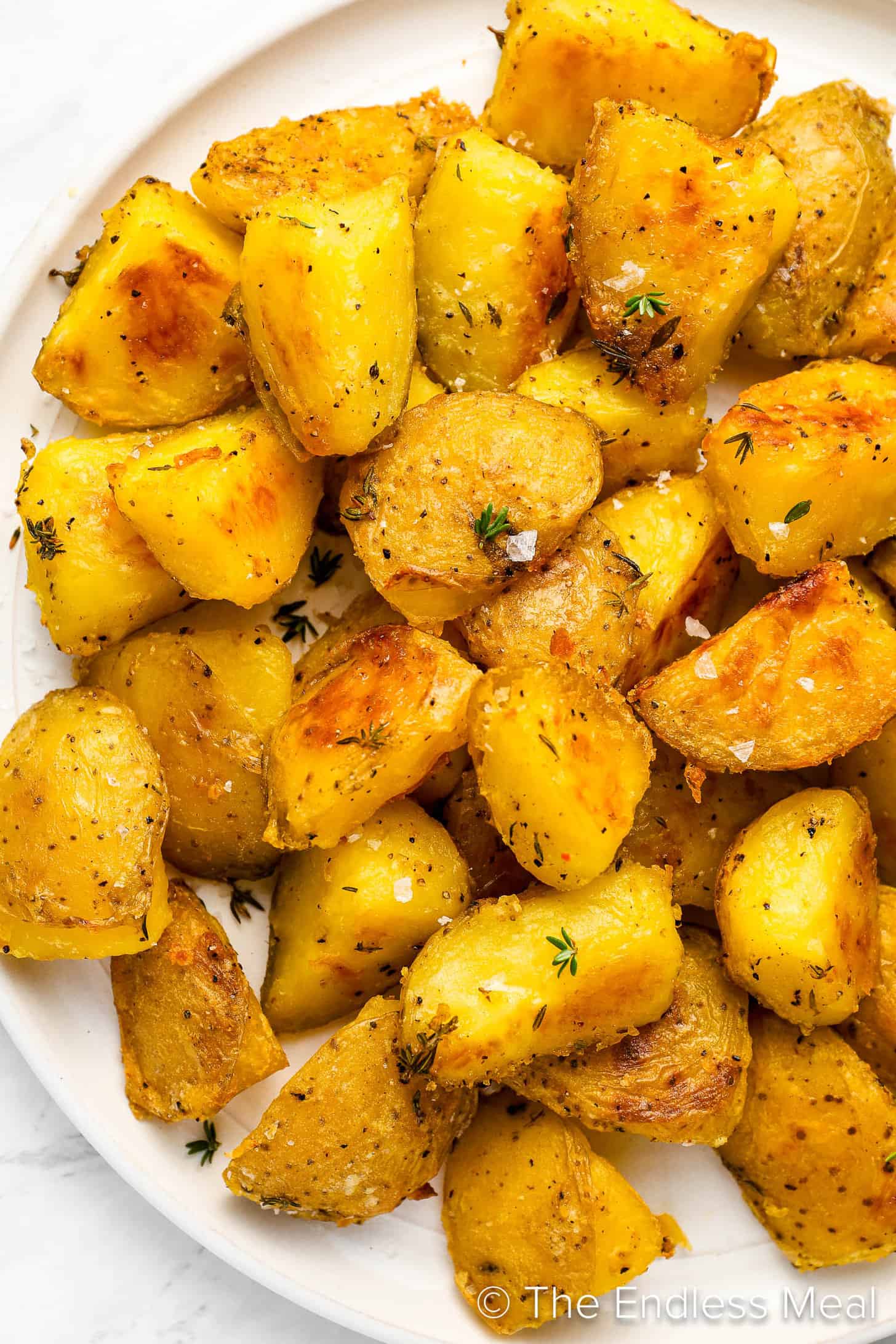A close up of Crispy Roasted Potatoes in a serving bowl