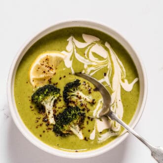 Roasted Broccoli Soup in a bowl with a spoon.