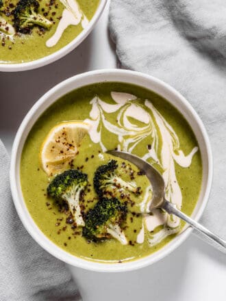 Roasted Broccoli Soup in a bowl with a spoon.