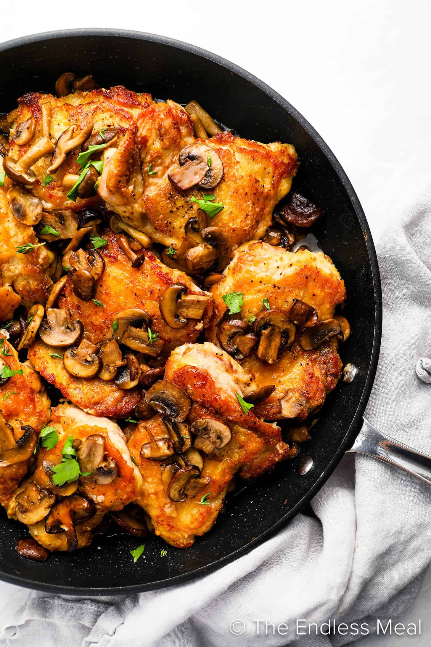 Cooking Chicken and Mushrooms in a pan