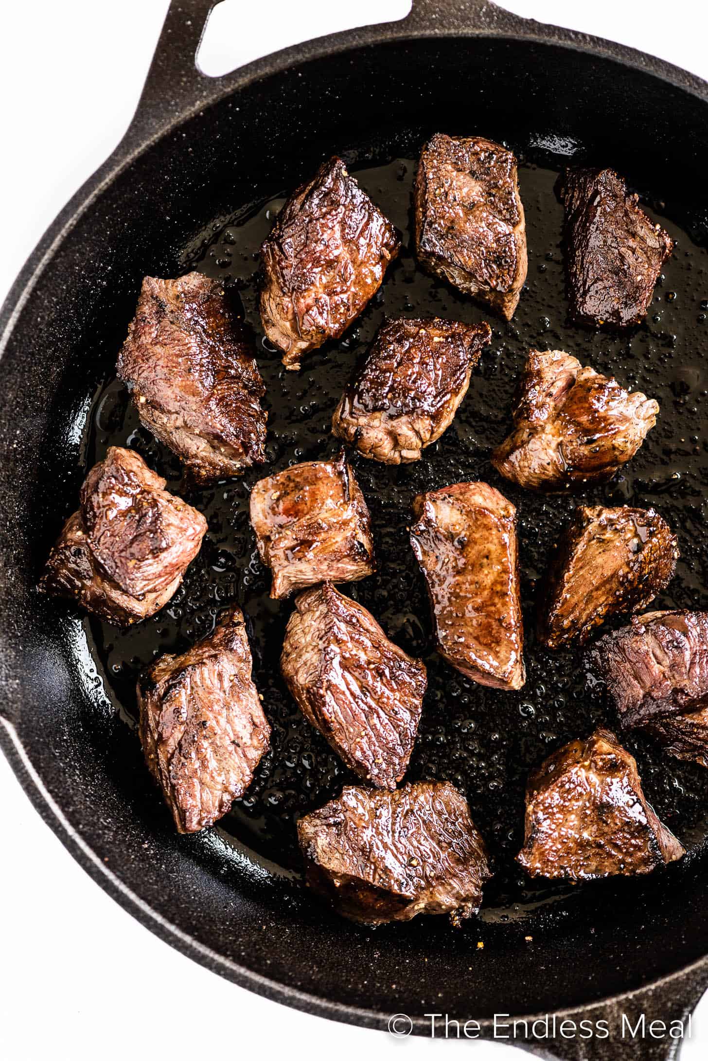 steak bite appetizers in a cast iron pan