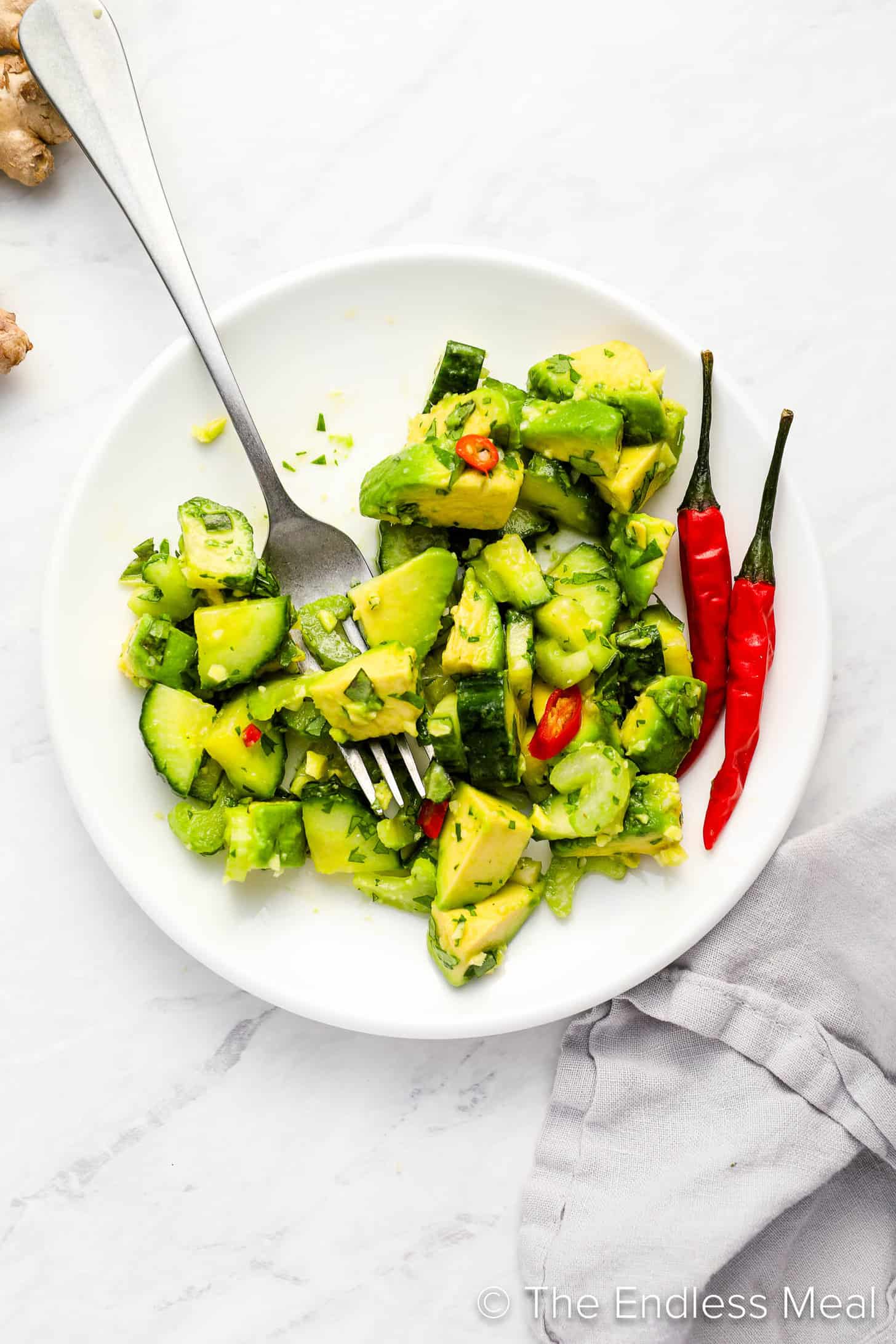Avocado Cucumber Salad on a side plate