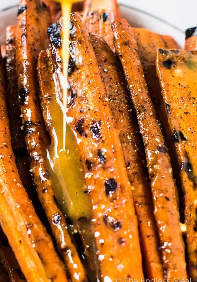 These might just be the best darn Maple Dijon Carrots ever. No lie. They're grilled on the BBQ then covered in an easy to make and super delicious maple dijon sauce. They're a naturally vegan + gluten-free + paleo side dish recipe that everyone will fall in love with.  | theendlessmeal.com