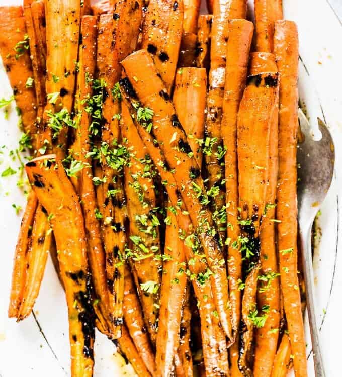 These might just be the best darn Maple Dijon Carrots ever. No lie. They're grilled on the BBQ then covered in an easy to make and super delicious maple dijon sauce. They're a naturally vegan + gluten-free + paleo side dish recipe that everyone will fall in love with.  | theendlessmeal.com