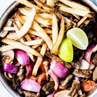 If you haven't had Lomo Saltado before, you're in for a real treat. As strange as it sounds, it's a Peruvian Steak and French Fry Stir Fry and it's absolutely delicious. It's a simple to make and healthy dinner recipe that can easily be adapted to make it gluten-free + paleo + Whole30 compliant.  | theendlessmeal.com