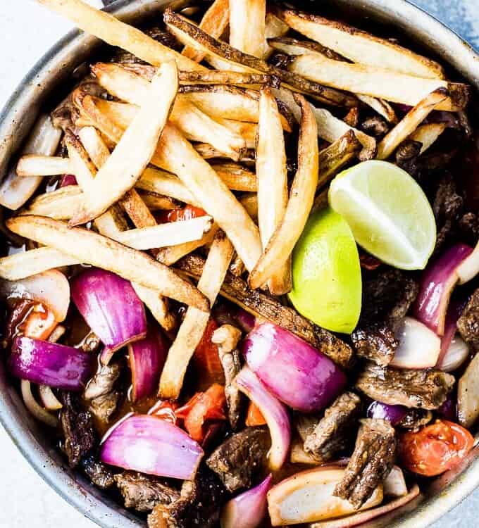 If you haven't had Lomo Saltado before, you're in for a real treat. As strange as it sounds, it's a Peruvian Steak and French Fry Stir Fry and it's absolutely delicious. It's a simple to make and healthy dinner recipe that can easily be adapted to make it gluten-free + paleo + Whole30 compliant.  | theendlessmeal.com
