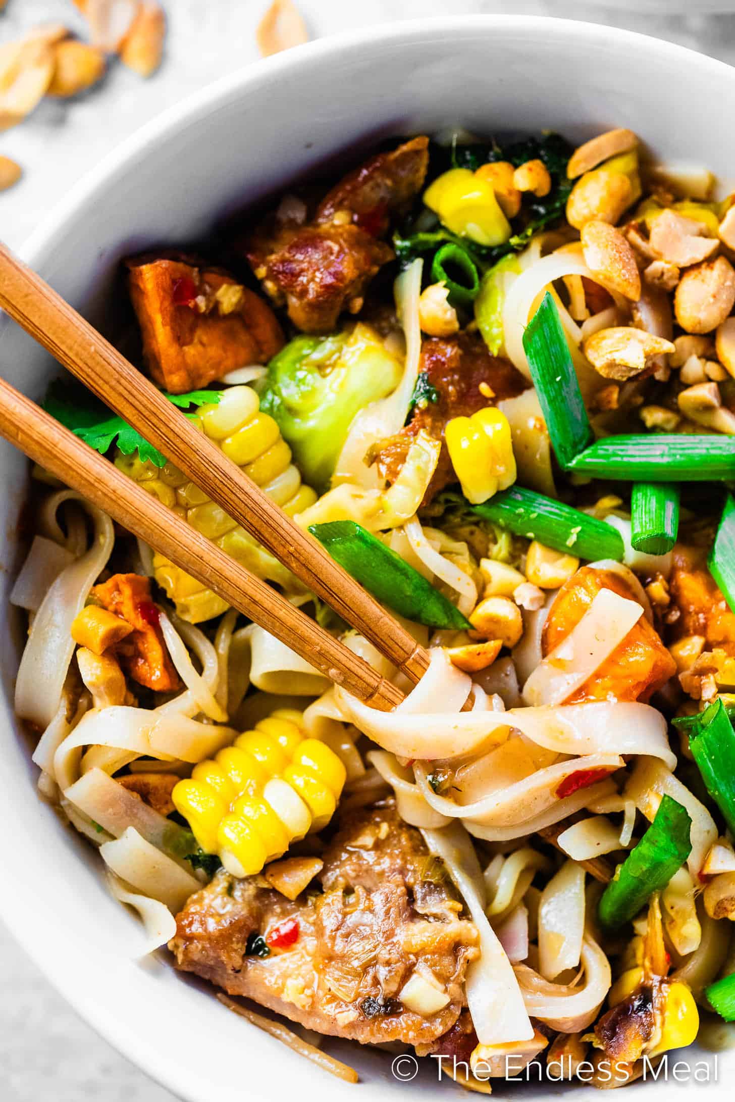 A close up of Sweet Potato Pad Thai in a dinner bowl.