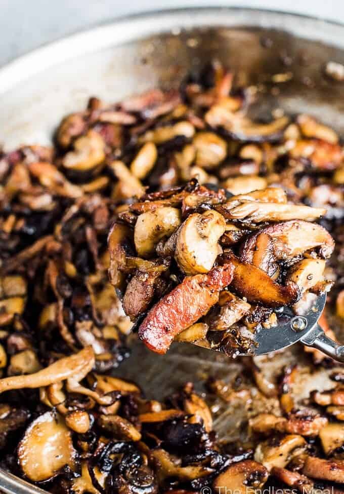 These crazy delicious Garlic Bacon Mushrooms are the ultimate side dish. They're easy enough to make as a weeknight side yet tasty enough to serve alongside a Thanksgiving or Christmas dinner. This recipe is also 100% gluten-free + paleo + Whole30 approved. Dig in, my friends! | theendlessmeal.com