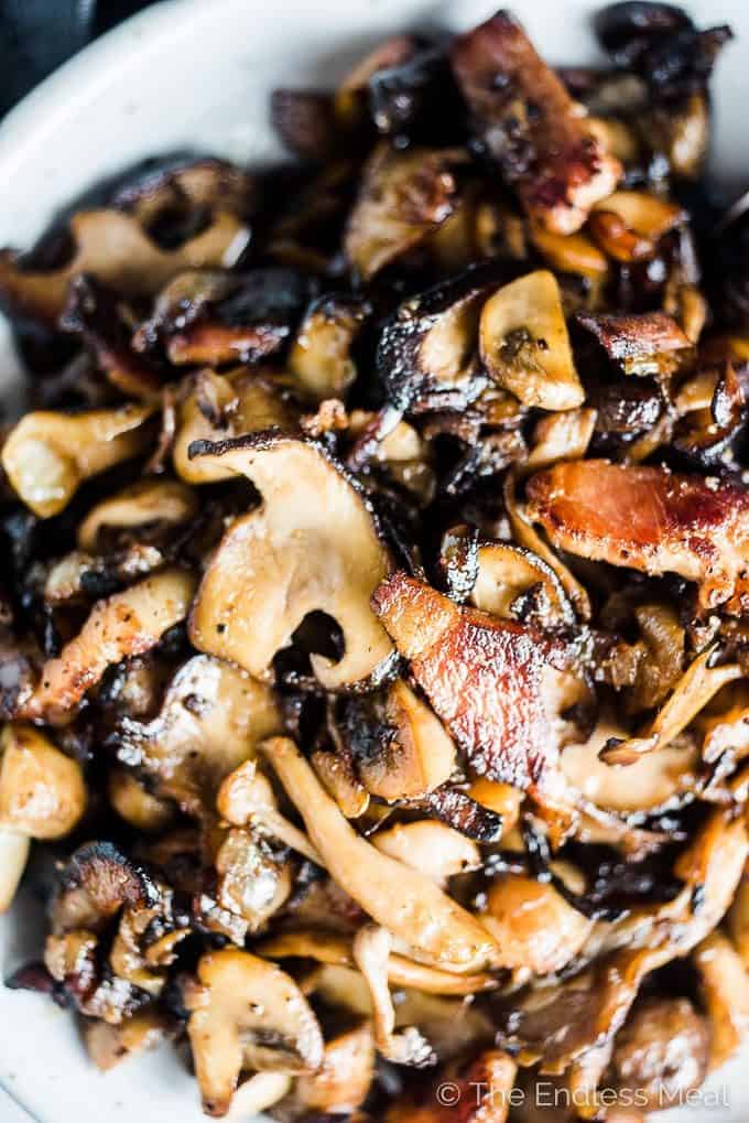 These crazy delicious Garlic Bacon Mushrooms are the ultimate side dish. They're easy enough to make as a weeknight side yet tasty enough to serve alongside a Thanksgiving or Christmas dinner. This recipe is also 100% gluten-free + paleo + Whole30 approved. Dig in, my friends! | theendlessmeal.com