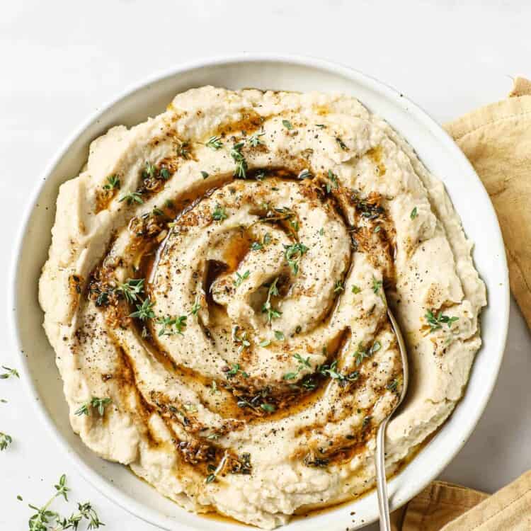 Brown Butter Mashed Cauliflower with a spoon in a bowl