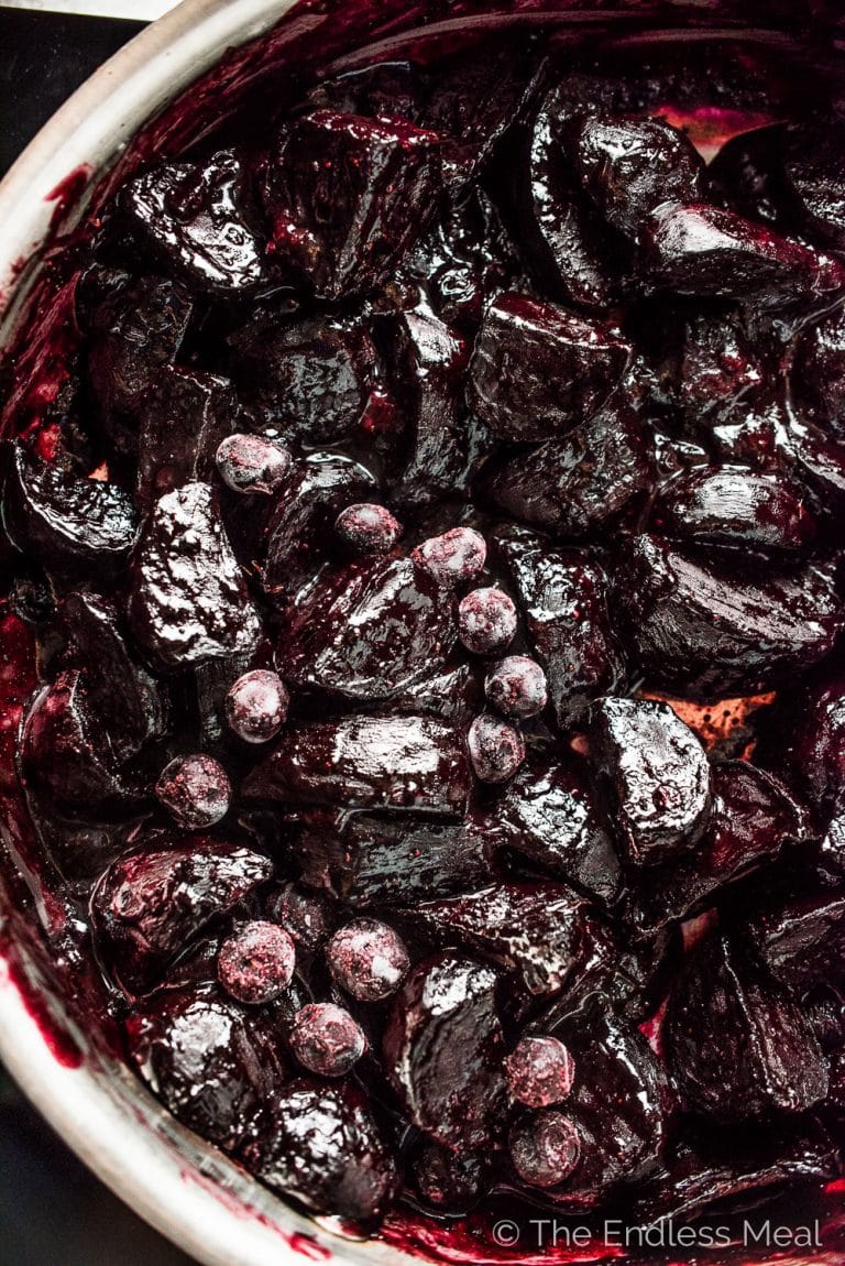 These insanely delicious Blueberry Balsamic Glazed Beets are a must for your Thanksgiving or Christmas table. Or heck, all winter long. The beets are roasted then coated in a sugar-free, sticky glaze made with frozen blueberries and balsamic vinegar. This healthy side dish recipe is also gluten-free + paleo + Whole30 compliant! | theendlessmeal.com | #blueberries #beets #thanksgiving #christmas #ThanksgivingRecipes #whole30 #paleo #sugarfree #bcblueberries