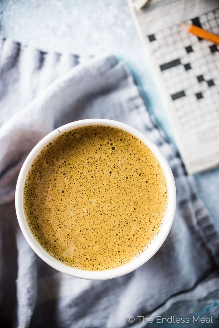 This delicious Coconut Turmeric Latte is the ultimate healthy indulgence. It tastes like a creamy dessert coffee but is so good for you. Don't worry, even though you don't taste the turmeric, you still get all of its health benefits. | theendlessmeal.com | #turmeric #turmericlatte #latte #dairyfree #veganrecipes #whole30 #bulletproof 