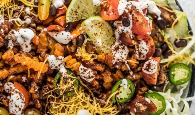 Looking for the best healthy-ish French fry recipe ever? These loaded Taco Salad Fries are it! They're made with super fun butternut squash zig zags and are piled high with all your favorite taco salad ingredients. Serve these as a Super Bowl appy or a delicious, kid-friendly dinner. You love them! | theendlessmeal.com