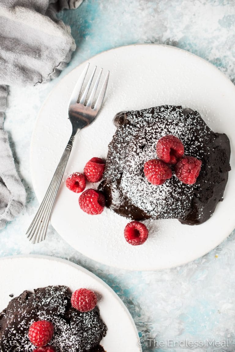If you're looking for the best Molten Chocolate Lava Cakes recipe, you've come to the right place. These babies are super rich, perfectly sweetened, and every bit as ooey and gooey as they should be. (PS. don't tell anyone but the ingredients are all healthy, too!) | theendlessmeal.com | #lavacake #cake #valentinesrecipes #vitalproteins #collagen #glutenfree