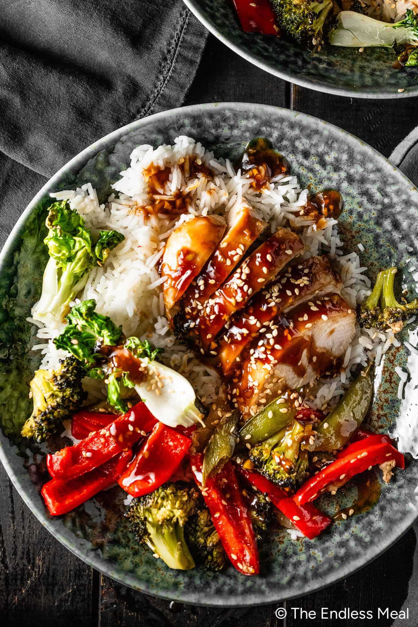 Asian Chicken Sheet Pan Dinner with rice in a dinner bowl