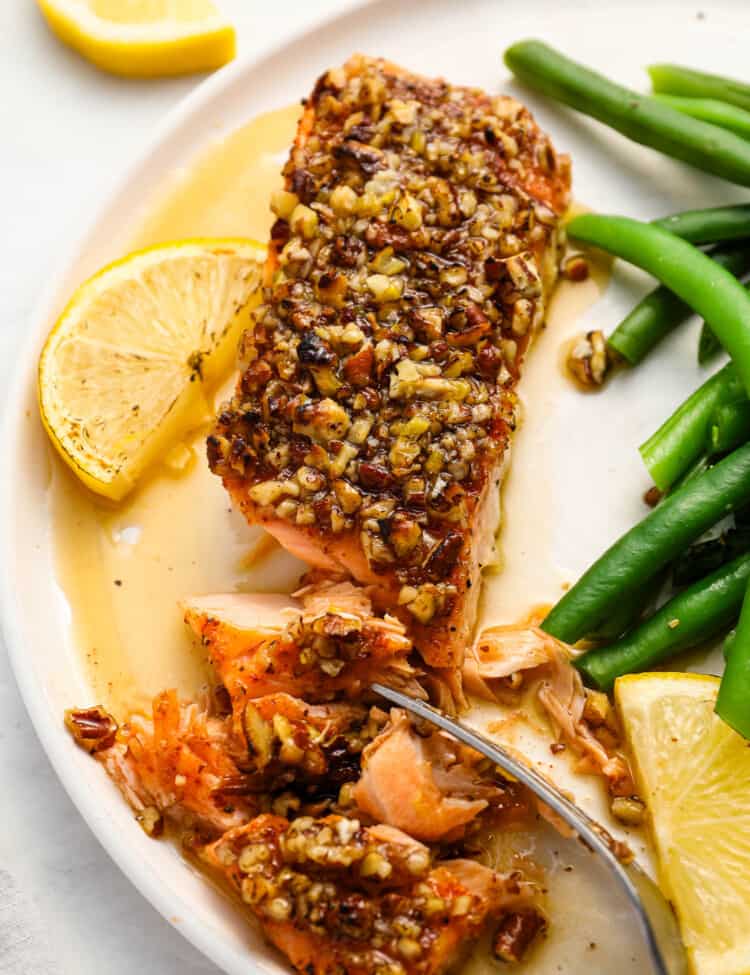 A fork cutting into Pecan Crusted Salmon