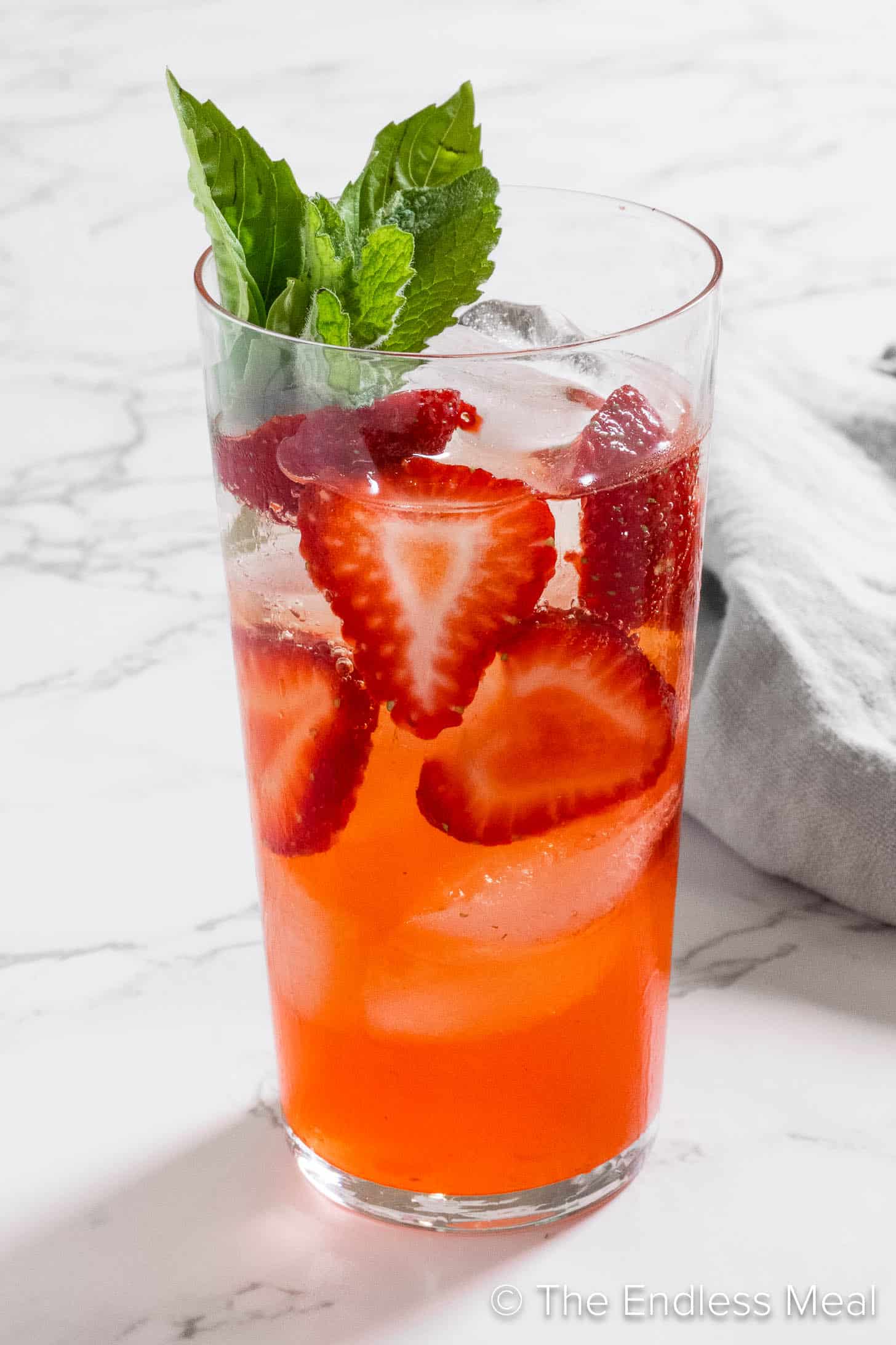 A Strawberry Mojito in a tall glass
