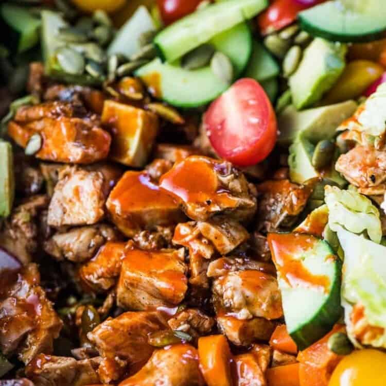This delicious Buffalo Chicken Salad is loaded with crispy romaine hearts, spicy buffalo chicken, all your favorite veggies and tossed in a healthy and super tasty avocado ranch dressing. We like it as a hearty dinner salad but it's just as good as a part of a bigger BBQ meal.  | gluten-free + paleo + Whole30 adaptable | #theendlessmeal #chicken #salad #buffalochicken #ranch #whole30 #paleo #glutenfree #healthyrecipes