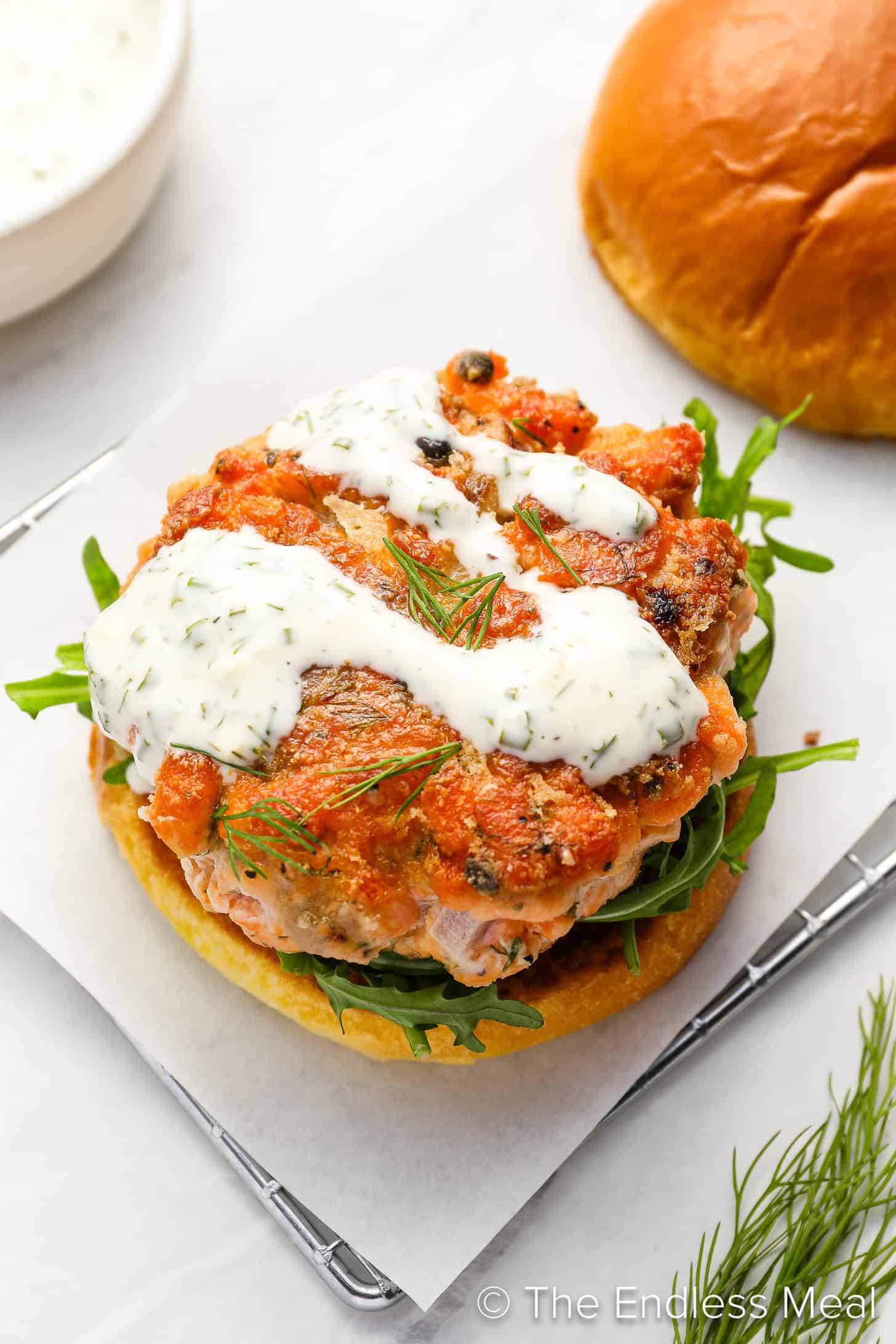 Salmon Burgers with sauce on a dinner plate