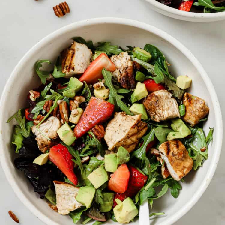 Strawberry Balsamic Chicken Salad in a bowl on the dinner table