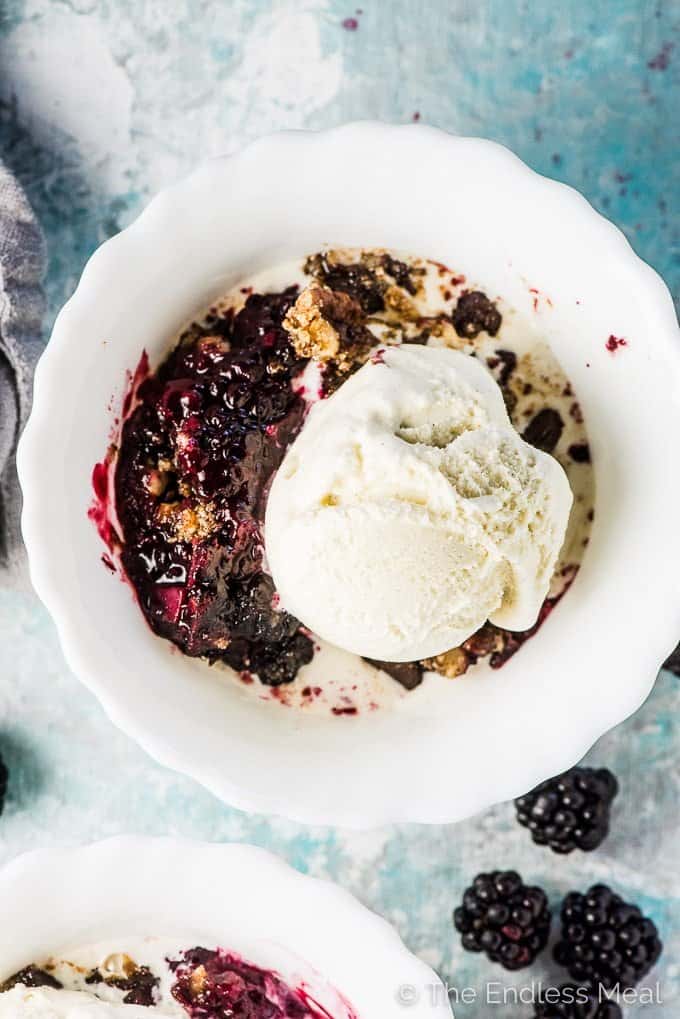 SAVE FOR LATER! This Chocolate Blackberry Crumble is so good you'll NEVER know it's a healthy dessert recipe. The grain-free topping resembles your favorite traditional crumble topping but it's made without oats. It's crazy delicious. | vegan + paleo + gluten-free + refined sugar-free | #theendlessmeal #blackberries #crumble #crisp #refinedsugarfree #paleo #vegan #glutenfree #blackberrycrumble #berrycrumble #fruitcrumble #summer #dessert #bakedfruit