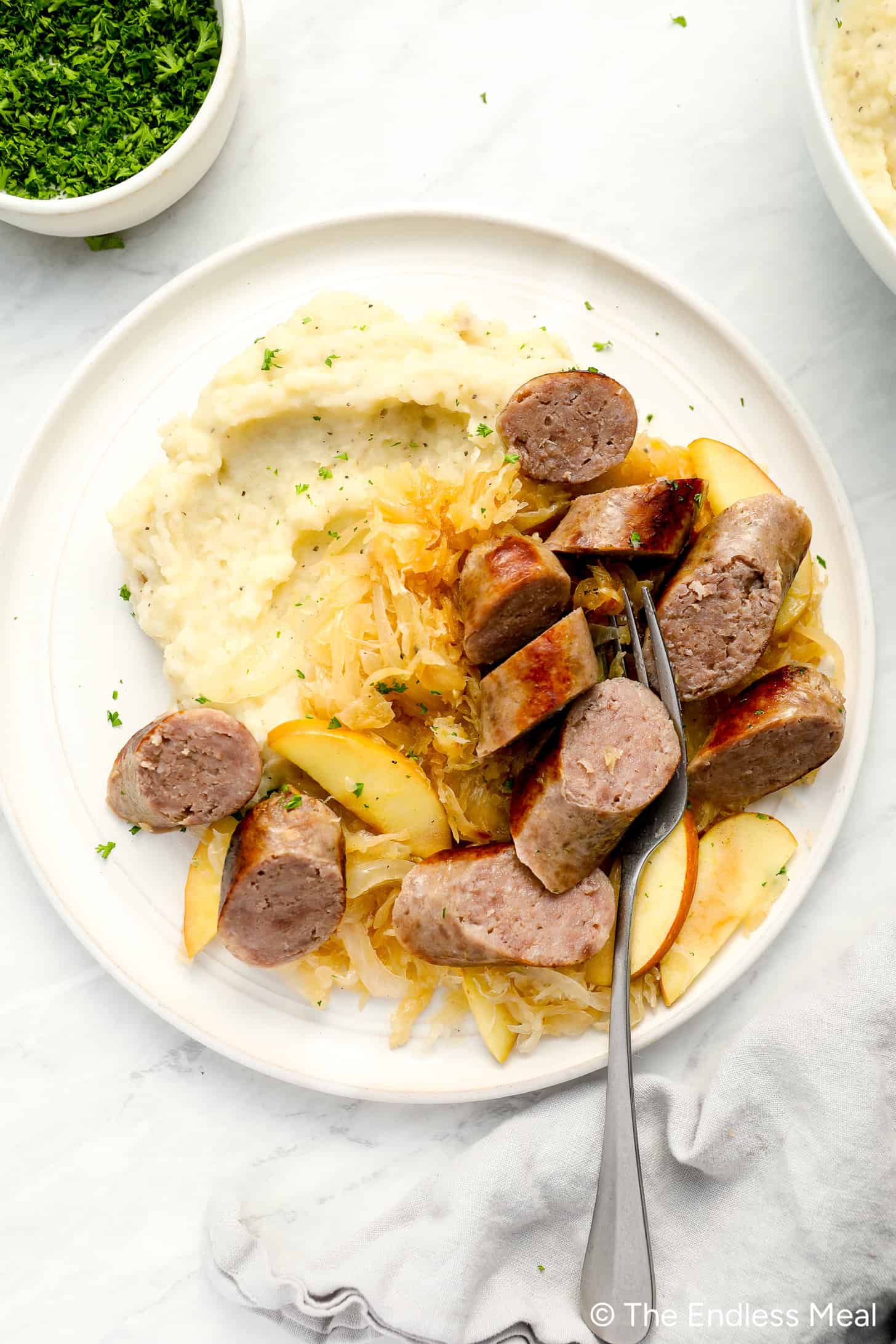 Bratwurst and Sauerkraut on a dinner plate