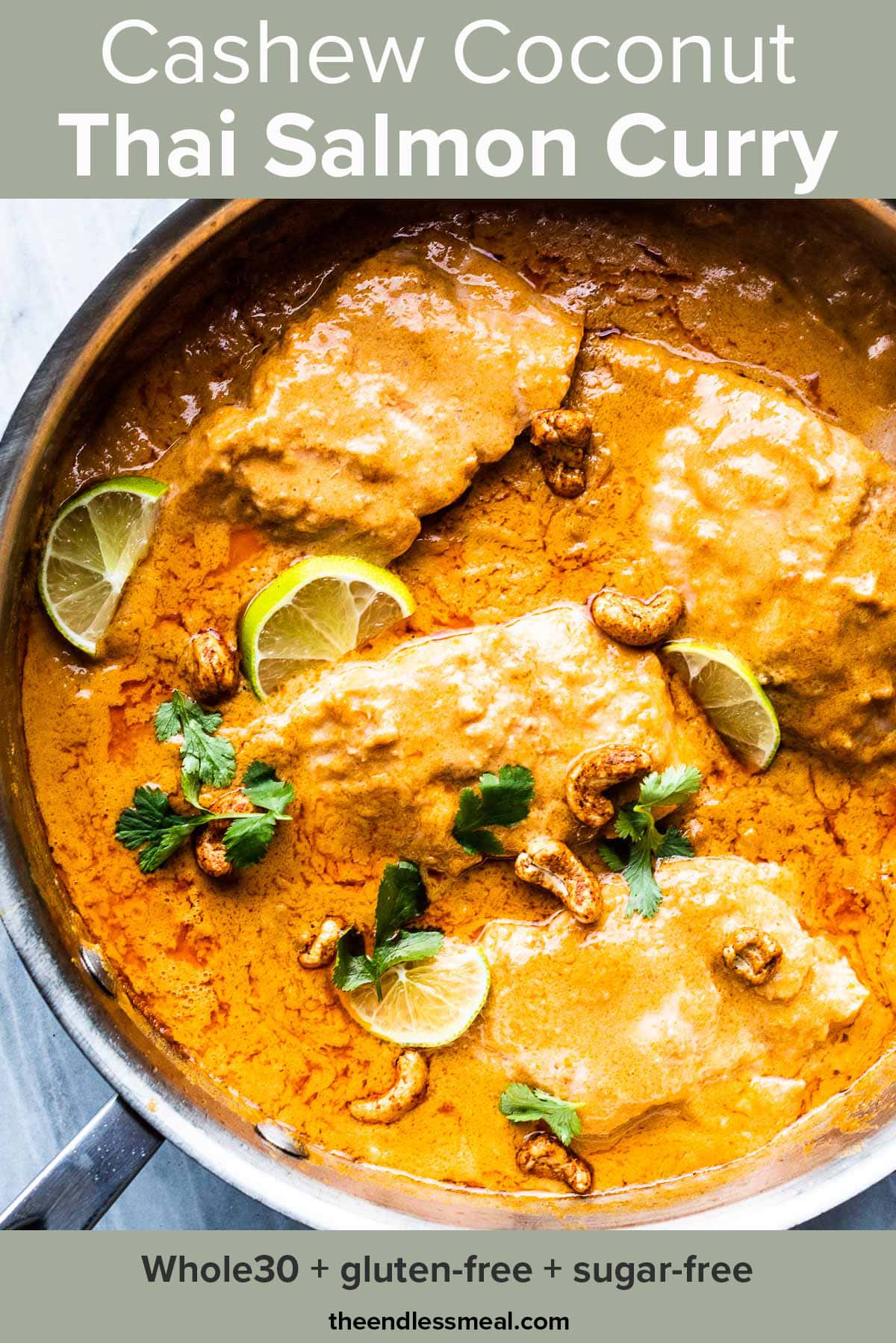 coconut salmon curry in a pan with limes and cashews with the recipe title on top of the picture.