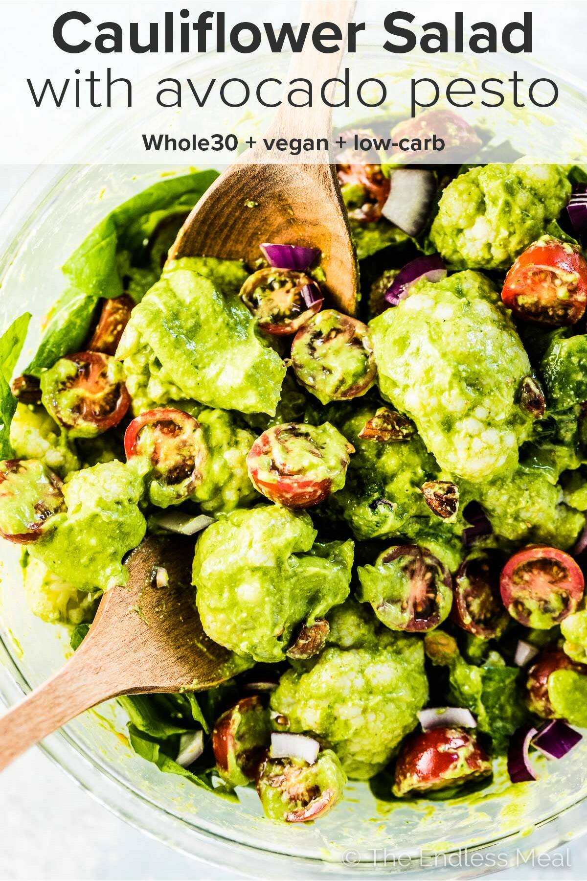 Cauliflower Salad with creamy avocado pesto dressing and the title on top of the picture.
