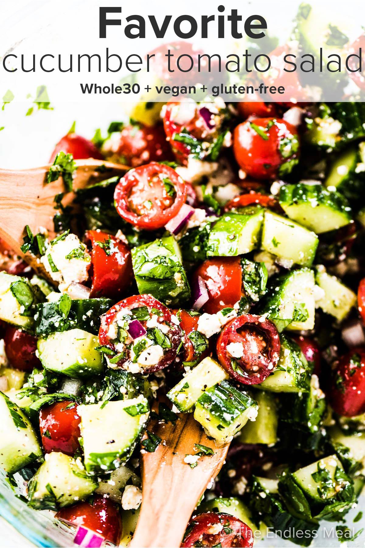 A close up of this cucumber tomato salad recipe with the title at the top of the picture. 