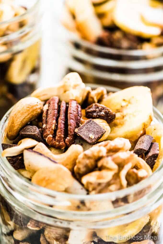 Homemade trail mix in glass jars.