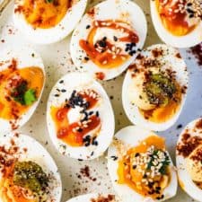 A plate of easy deviled eggs made three different ways.