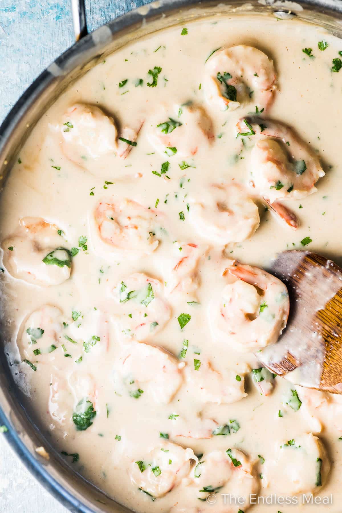 Saucy creamy Coconut Shrimp in a frying pan.