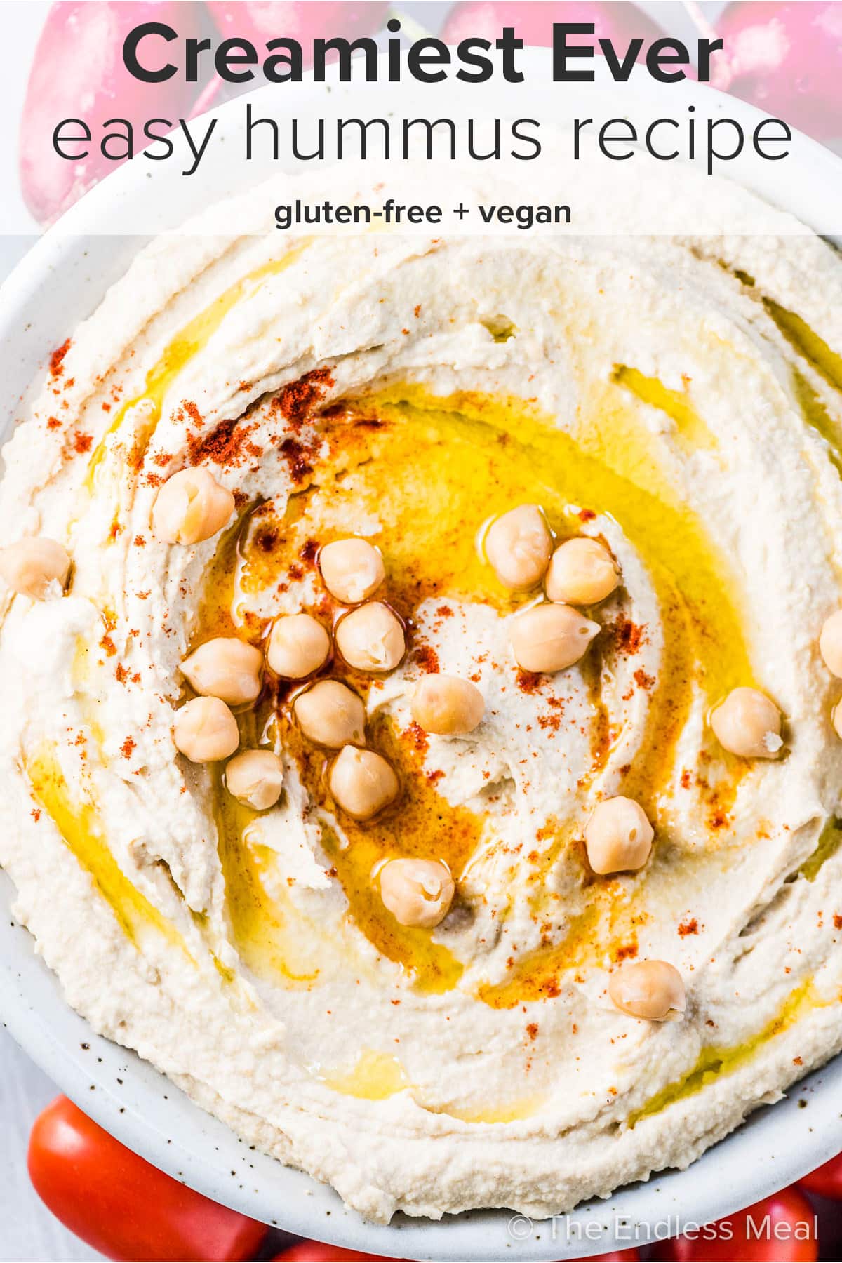 A bowl of the creamiest hummus ever and the recipe title on top of the picture.