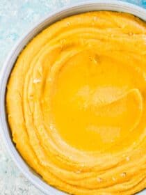 Creamy sweet potato hummus in a blue bowl.