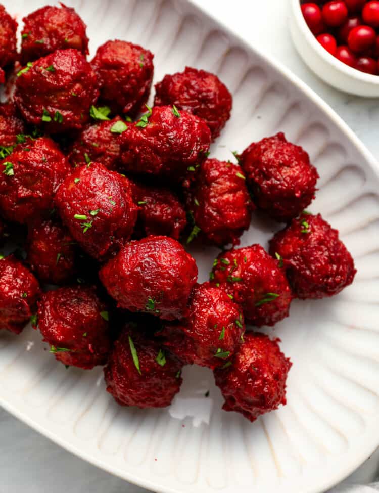 Cranberry Meatballs on an appetizer serving plate.