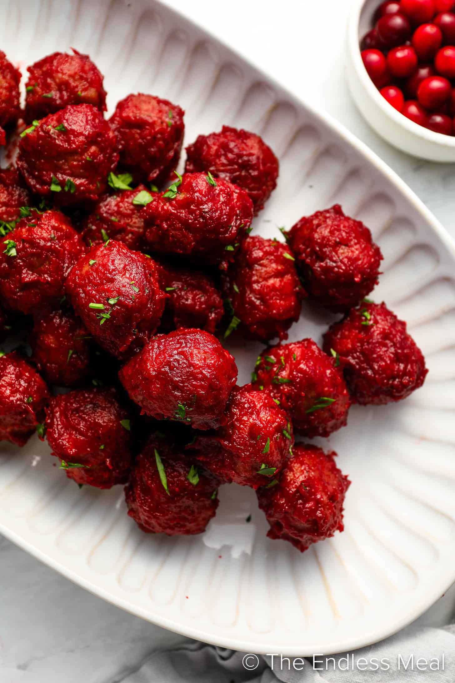 Cranberry Meatballs on an appetizer serving plate.