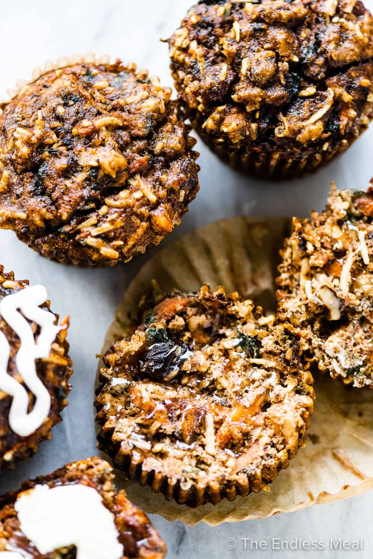 Healthy carrot cake muffins on a marble surface. 