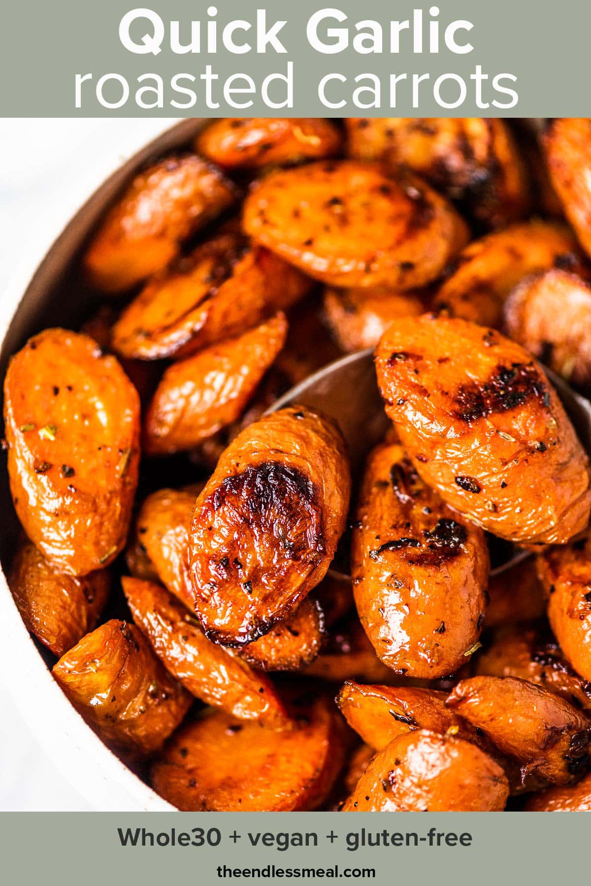 A white bowl filled with easy garlic roasted carrots with the recipe title on top of the picture.