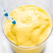 Mango coconut smoothie in a glass.