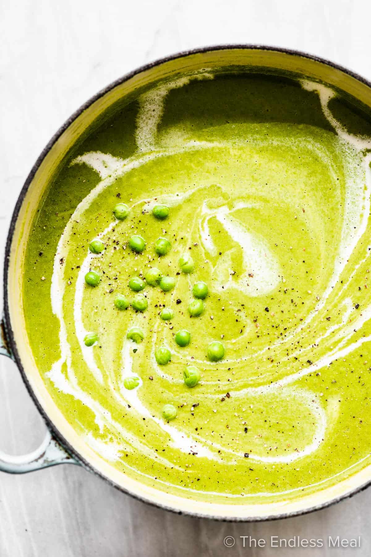 Pea soup made with frozen peas in a pot.