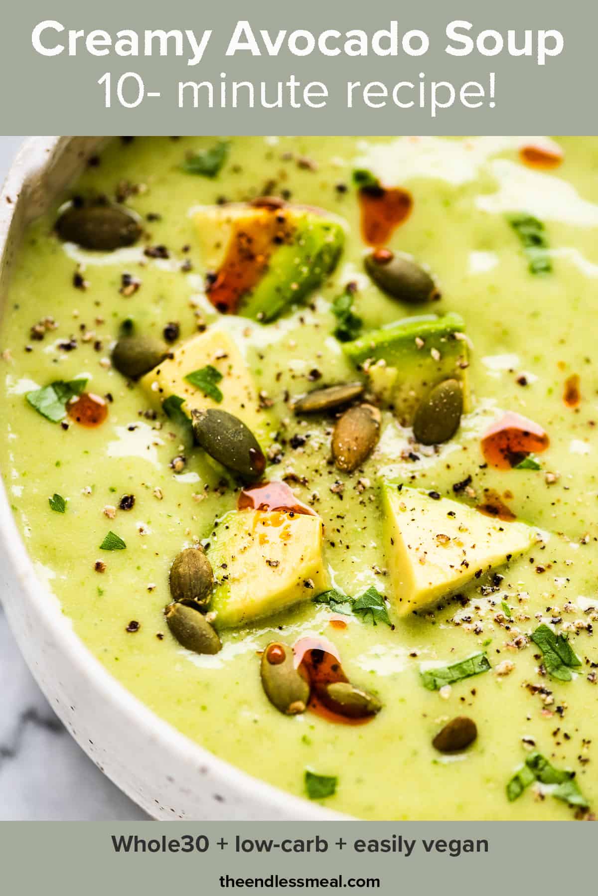 A close up of diced avocados on top of a bowl of avocado soup and the recipe title on top of the picture. 