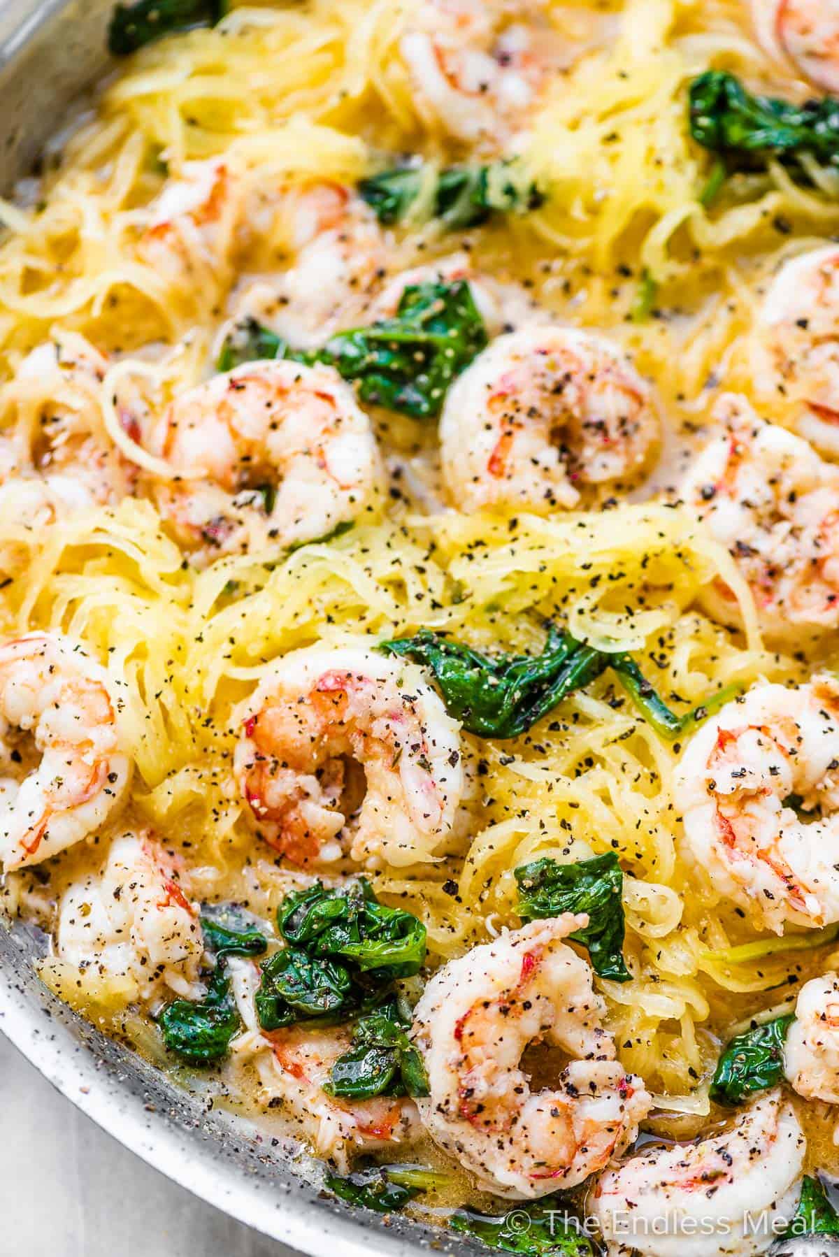 A close up of spaghetti squash shrimp scampi in a pan. 