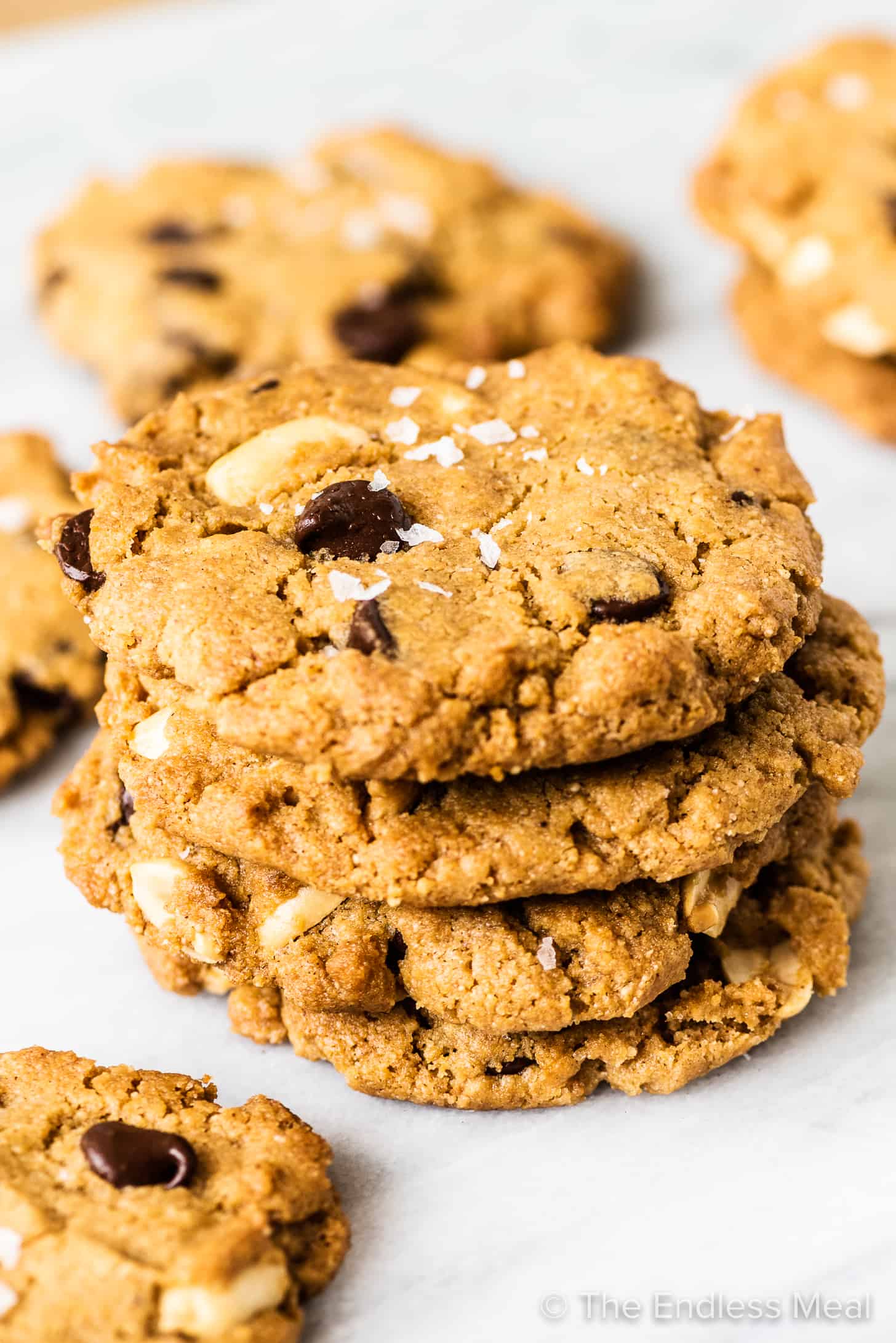 A stack of gluten free peanut butter cookies with chocolate chips.