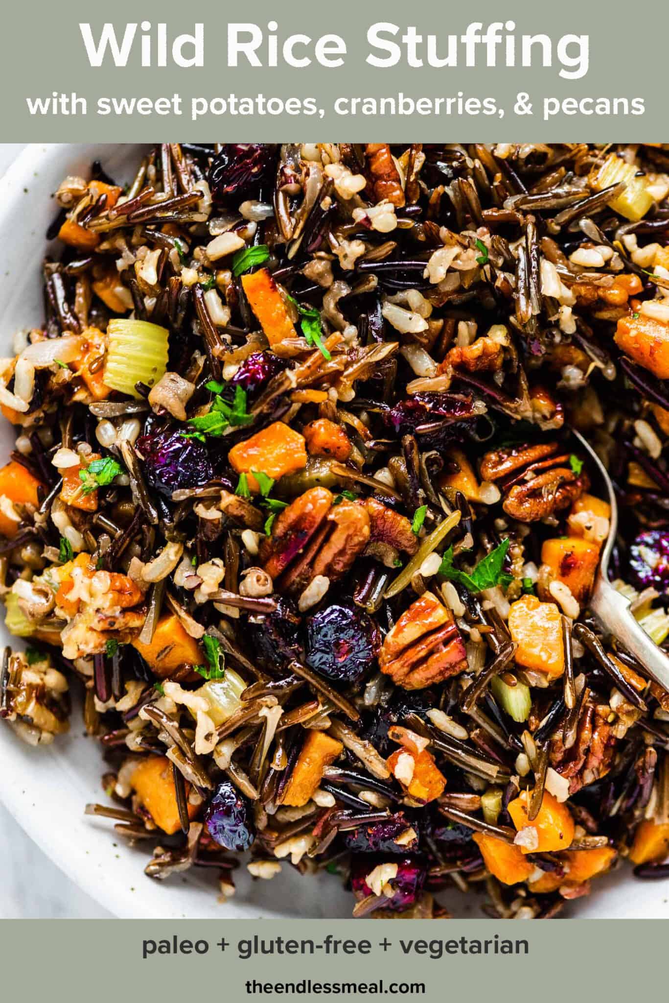 A serving bowl with wild rice stuffing with the recipe title on top of the picture.
