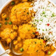 A bowl of cauliflower curry and rice.