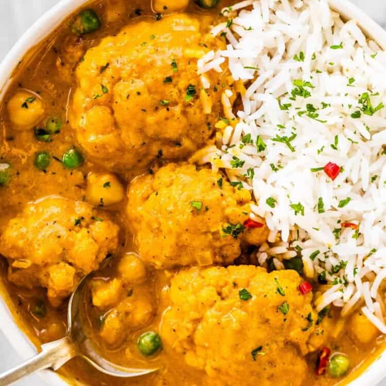 A bowl of cauliflower curry and rice.